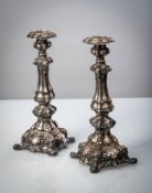 A PAIR OF SILVER CANDLESTICKS AND A TEA CADDY