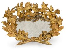 A DECORATIVE CARVED AND GILT WOOD FRAME