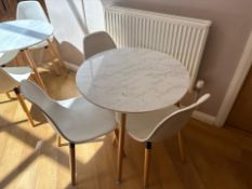 White Wooden Table With Three Plastic Chairs