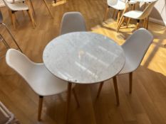 White Wooden Table With Three Plastic Chairs