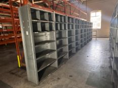 9 Bays Of Metal Shelving Made of 10 Frames and 63 Shelves