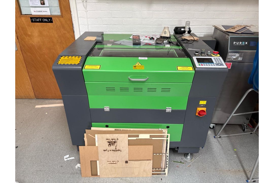 Laser Cutting Machine Used for cutting and engraving wood No visible ...