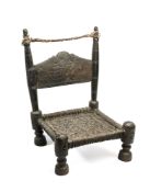 A CARVED AND TURNED WOOD LOW CHAIR, SWAT VALLEY, PAKISTAN, 19TH CENTURY