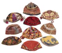 A COLLECTION OF HATS, UZBEK, AFGHAN AND TURKMAN, 20TH CENTURY
