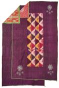 AN IKAT AND SILK QUILTED PANEL, AND A PLAIN SILK QUILTED PANEL, UZBEKISTAN, CIRCA 1900