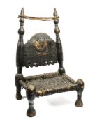 A CARVED AND TURNED WOOD LOW CHAIR, SWAT VALLEY, PAKISTAN, 19TH CENTURY