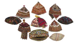 A COLLECTION OF TEN EMBROIDERED AND DECORATED HATS, UZBEKISTAN, AFGHANISTAN, PAKISTAN, 20TH CENTURY