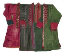 A CRIMSON SILK VELVET TURKMAN ROBE (KURTE) AND THREE SILK KURTE, CENTRAL ASIA, LATE 19TH CENTURY