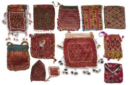 A COLLECTION OF EMBROIDERED PURSES AND POUCHES, HAZARA, AFGHANISTAN, LATE 19TH/20TH CENTURY