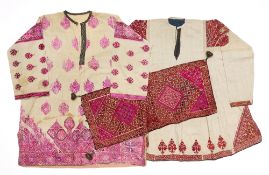 A PHULKARI SILK EMBROIDERED PILLOW COVER AND TWO SWAT DRESSES, PAKISTAN, EARLY 20TH CENTURY