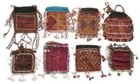 A COLLECTION OF EIGHT HAZARA POUCHES, AFGHANISTAN, LATE 19TH/EARLY 20TH CENTURY