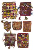 A COLLECTION OF SEVEN EMBROIDERED POUCHES, AFGHANISTAN, 20TH CENTURY