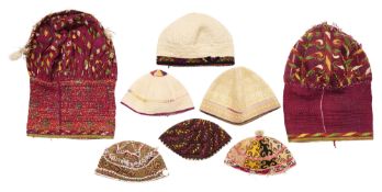 EIGHT TURKMAN AND CENTRAL ASIAN HATS, LATE 19TH, AND 20TH CENTURIES