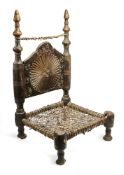 A CARVED AND TURNED WOOD LOW CHAIR, SWAT VALLEY, PAKISTAN, 19TH OR EARLY 20TH CENTURY