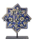 AN ILKHANID STAR TILE, PERSIA, 14TH CENTURY