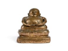 A BRONZE SEATED FIGURE OF BUDAI, (PHRA PU TAI) BURMA OR NORTHERN THAILAND, 19TH CENTURY