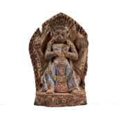 A CARVED AND PAINTED WOOD RELIEF OF A BOAR HEADED DEITY, NEPAL, 16TH/17TH CENTURY