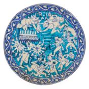 A POTTERY CHARGER PAINTED WITH A RAMAYANA SCENE, JAIPUR, CIRCA 1900