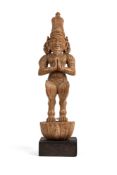 A CARVED WOOD FIGURE OF A SAGE, TAMIL NADU, SOUTH INDIA, 19TH CENTURY