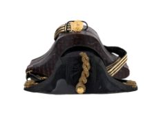 A CASED BRITISH NAVAL OFFICER’S BICORN HAT, SWORD BELT, AND CASED EPAULETTES