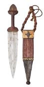 A NORTH AFRICAN ARM DAGGER, LATE 19TH/EARLY 20TH CENTURY