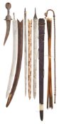 AN INDIAN DAGGER, THREE SWORD-BLADES, AND SEVEN INDIAN ARROWS, MOSTLY 19TH CENTURY