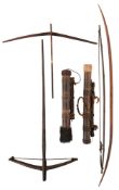 TWO SOUTH EAST ASIAN CROSSBOWS, TWO BOWS AND TWO QUIVERS, LATE 19TH/EARLY 20TH CENTURY