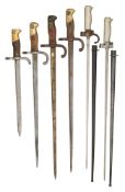 FOUR FRENCH 1874 MODEL GRAS BAYONETS, A FRENCH WWI PERIOD LEBEL BAYONET, AND