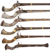 FIVE DECORATIVE INDIAN FLINTLOCK JEZAILS, AND A DECORATIVE INDIAN BLUNDERBUSS,