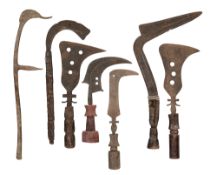 NINE CONGOLESE TRUMBASH KNIVES OF THE MANGBETU PEOPLE, AND TWELVE AFRICAN THROWING KNIVES OF THE