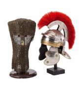 A MODERN REPRODUCTION ROMAN HELMET, AND A MODERN REPRODUCTION NORMAN POT HELMET WITH MAIL OUTER