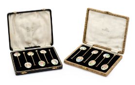 A SET OF TWELVE SILVER-GILT AND ENAMEL COFFEE SPOONS, WALKER & HALL LTD., BIRMINGHAM, 1955/56