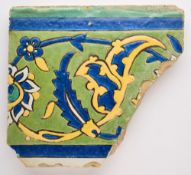 A SAFAVID CUERDA SECA BORDER TILE FRAGMENT, PERSIA, 17TH CENTURY