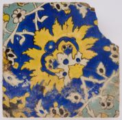 A FRAGMENTARY SAFAVID CUERDA SECA TILE, PERSIA, 17TH CENTURY