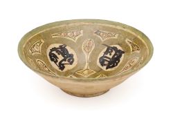 A NISHAPUR SLIP PAINTED BOWL, PERSIA, CIRCA 10TH CENTURY
