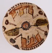 A NISHAPUR SLIP-PAINTED POTTERY BOWL, PERSIA OR CENTRAL ASIA, CIRCA 10TH CENTURY