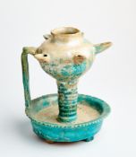 A TURQUOISE GLAZED POTTERY OIL LAMP, PERSIA, 12TH/13TH CENTURY