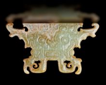 A GREEN JADE ANCESTOR MASK, POST-SHIJIAHE CULTURE (c 2000-1800 BC)