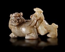 A CHINESE JADE OF AN IMMORTAL RIDING A BIXIE, HAN DYNASTY (206 BC–220 AD)