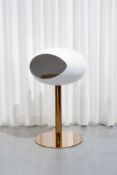 A compact Le Feu Bio Fireplace white ground steel