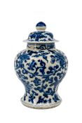 A Chinese blue and white florally decorated nankin covered porcelain vase