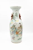 A Chinese Famille rose decorated porcelain vase with a scene of ladies in the garden