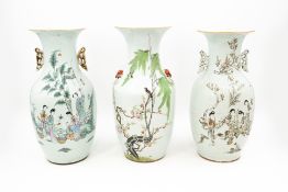 A lot of two Chinese Qianjiang cai porcelain vases, decorated with ladies in the garden and birds