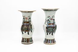 A composed lot of two Chinese yenyen shaped Famille rose valuables decorated porcelain vases