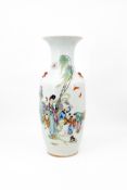 A Chinese Qianjiang and famille rose porcelain vase with a scene of a lady with the boys