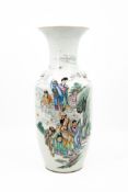 A Chinese Qianjiang and Famille rose decorated porcelain vase with a figural animated scene with imm