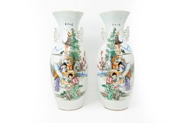A pair of Chinese Famille rose finely decorated porcelain vases with the decor of ladies in the gard