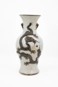 A Chinese dragon reliëf decorated crackled glazed vase with a dragon decor
