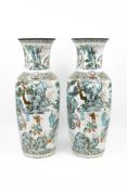 A lot of two matching Chinese Famille rose figural decorated porcelain vases