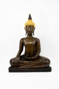An antique Thai gilt and patinated bronze figure of seated Buddha Ayutthaya
